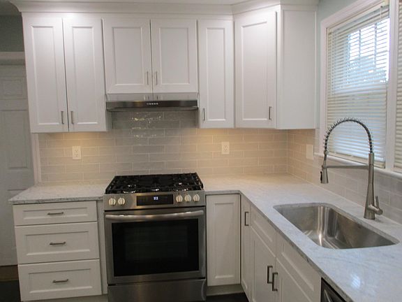 Brand New Updated Kitchen Cabinets, Appliances, Quartz Countertops and Tile Backsplash