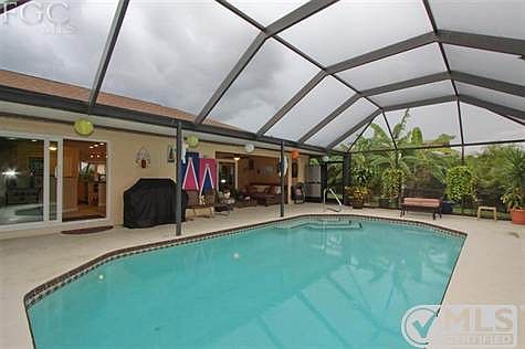 Heated pool with large lanai under roof. Large sundeck. Hot tub.