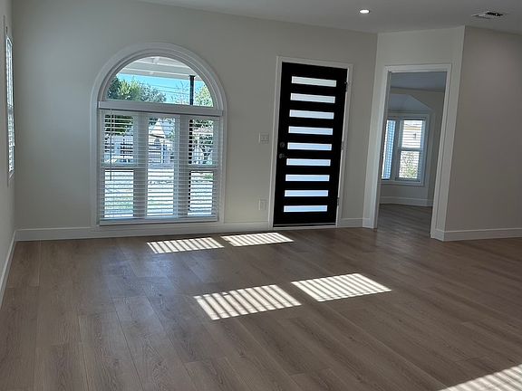 front door and big window with lots of sunlight