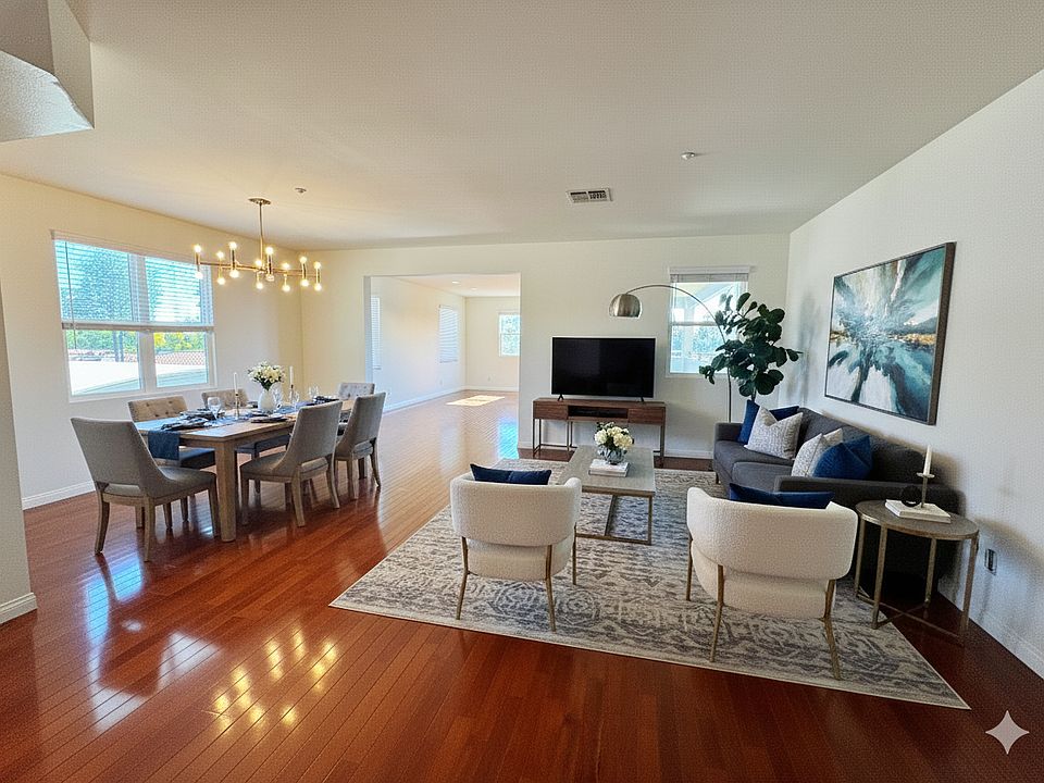 Dining room and living room. This photo is virtually staged and for illustration purposes only. Furniture is not included.