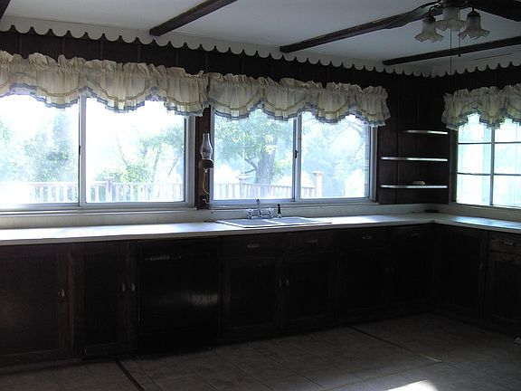 View of middle of kitchen including sink and dishwasher