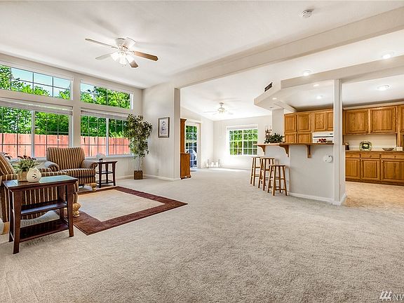 View of the living room and dining room with connected kitchen. Great for entertaining. 