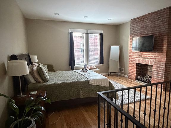 Master bedroom with gas log fireplace