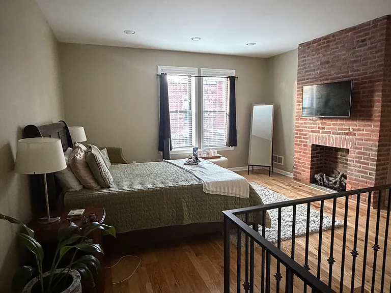 Master bedroom with gas log fireplace