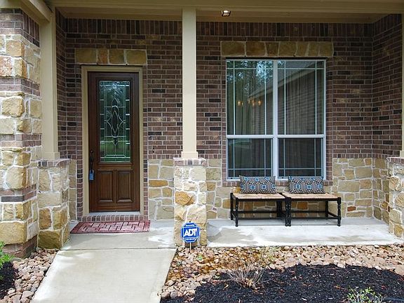 A cozy front porch greets your guests.