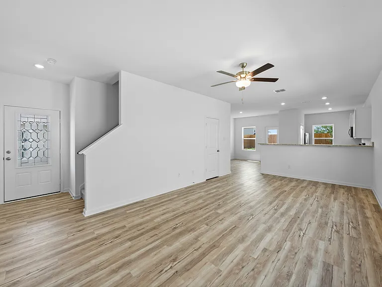Vinyl flooring throughout the main living space.
