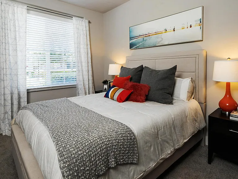 One-Bedroom Interior Featuring Neutral Tones and Modern Lamps