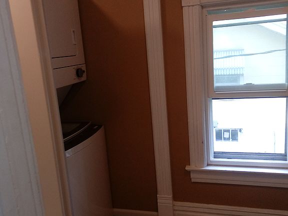 bathroom with stackable washer/dryer