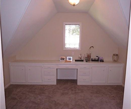 GAMEROOM UPSTAIRS WITH BUILT-IN DESK/ENTERTAINMENT CENTER.