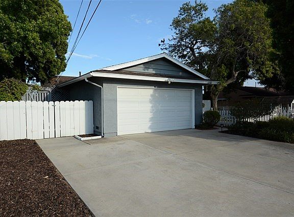 To the left side of the 2 Car Garage is the perfect potential RV Parking Pad.  There's even a sewer clean-out in the front yard for an RV waste dump.