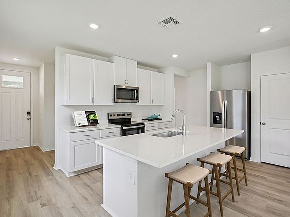 The Kitchen of the Acadia Virtually Staged.