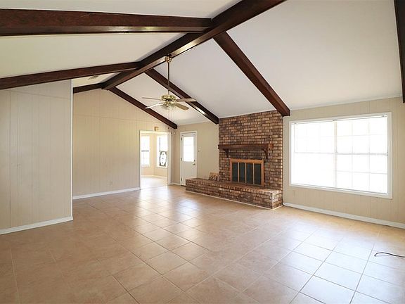 Large den with fireplace