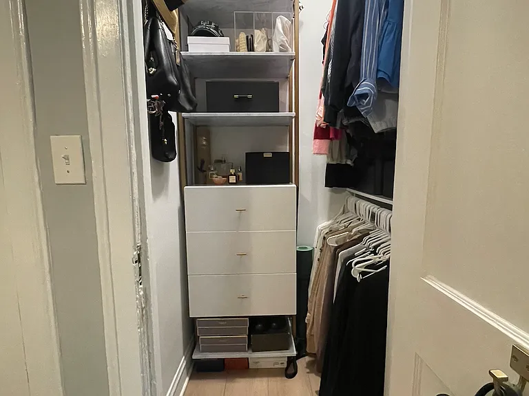One of Two Vintage-Style Walk-In Closets in the Primary Bedroom