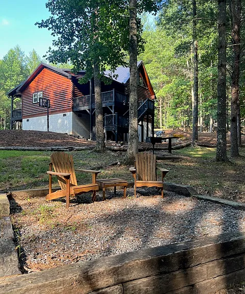back area ... this is where we use our removable fire pit. We have 2 adirondack chairs and additional folding chairs you can bring out found in our basement. Our basement is for storage only.