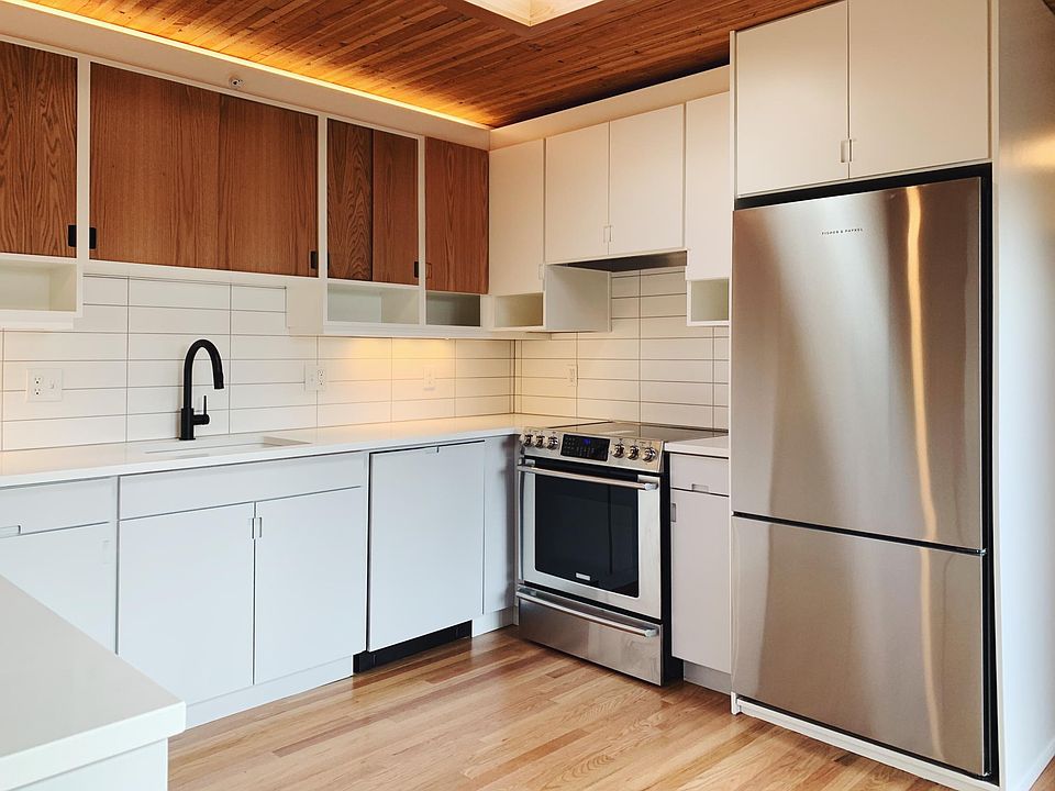 Designer kitchen, high-end and efficient appliances, ample cabinet storage.