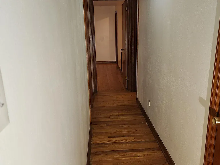 Hallway, looking towards 3BR (on left), MBR (straight ahead) and 2nd bath (on right).