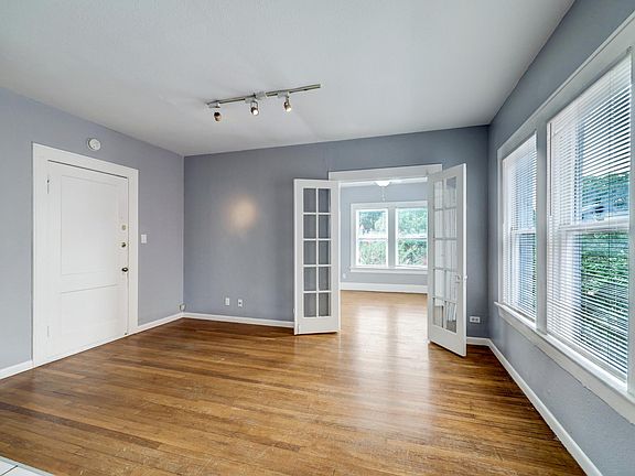 French doors lead you to the light and bright bedroom.