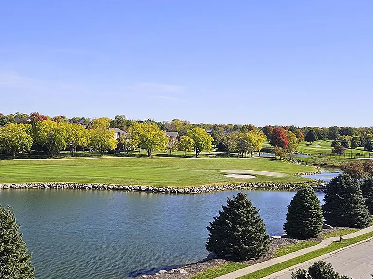 Explore the stunning landscape from your apartment with our lush golf course and pond views, a blend of rolling greens and reflective waters.
