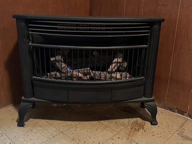 Gas fueled heater in recreation area, designed to look like a wood burner