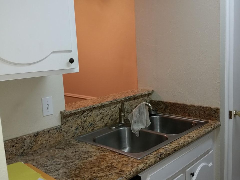 Kitchen with granite counter tops and pantry