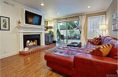 Spacious living room and view of patio