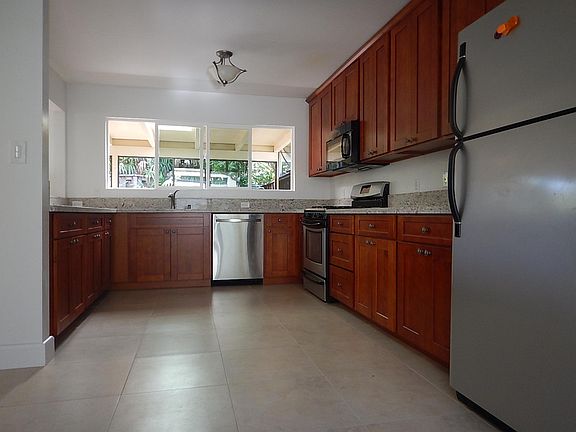 Spacious modern kitchen with pass-thru bar seating
