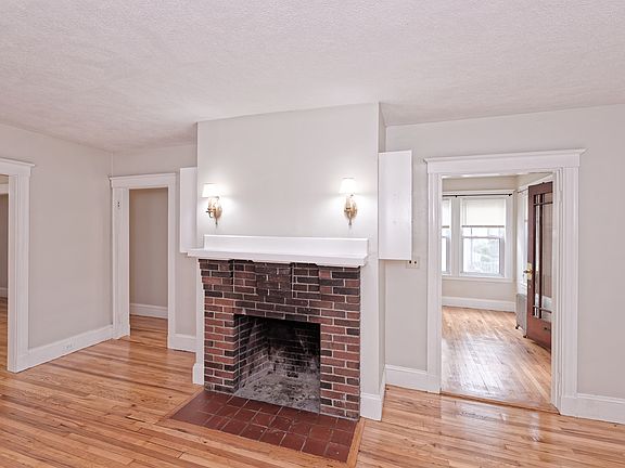 Living room with storage shelves on both sides of fireplace