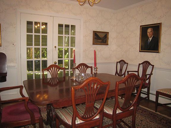 Formal dining room with French doors to screened porch