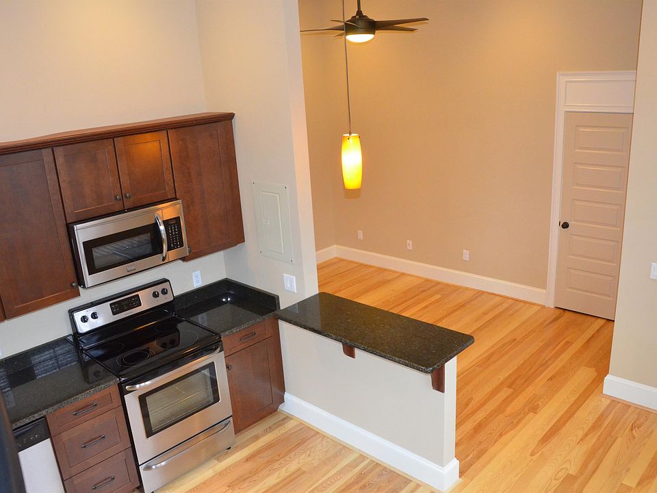 51 Allen 303 Living Room, Breakfast Bar, and Kitchen from top of spiral stairs