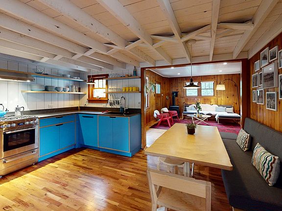 Fully stocked custom kitchen with modern appliances.