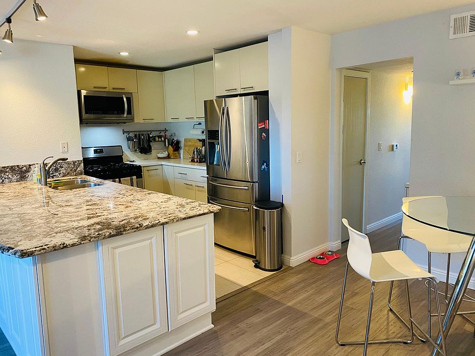 Open kitchen with ample counter space + cabinets, and modern, reliable appliances.