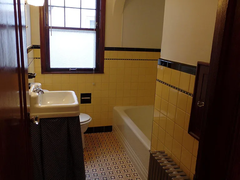Original 1930s tile. Laundry shoot, shower and bath combo.