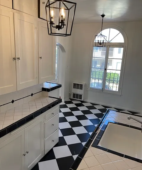 203 Kitchen and dining area with arched French windows