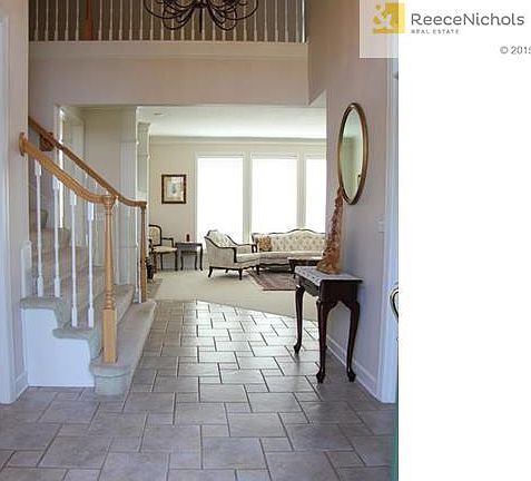 Elegant tiled Entry welcomes you into this beautiful Fairway Hi