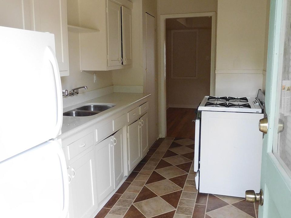 Kitchen with ceramic tile and quartz countertop