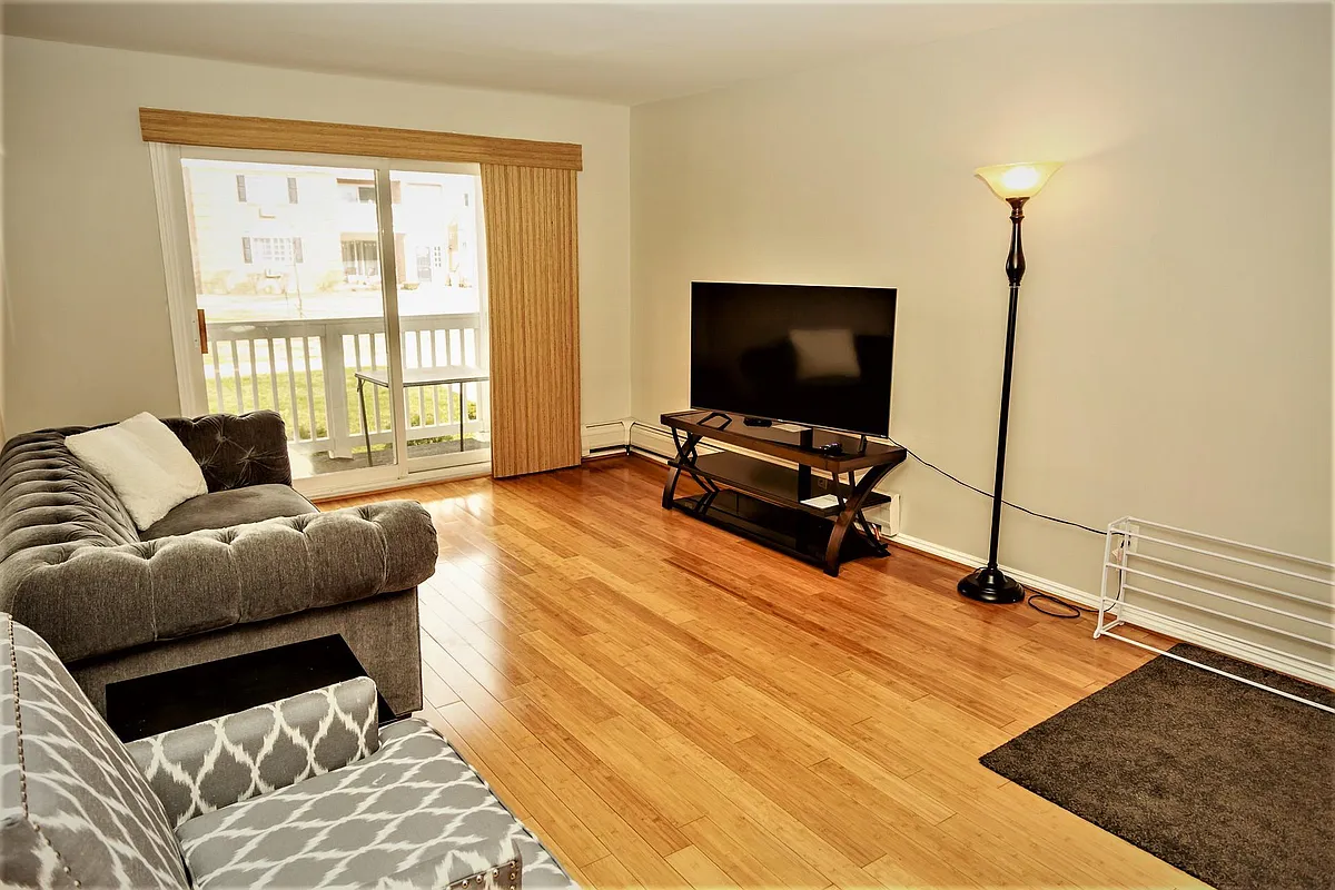 Big screen TV in the living room - 2440 Parmenter Blvd #50