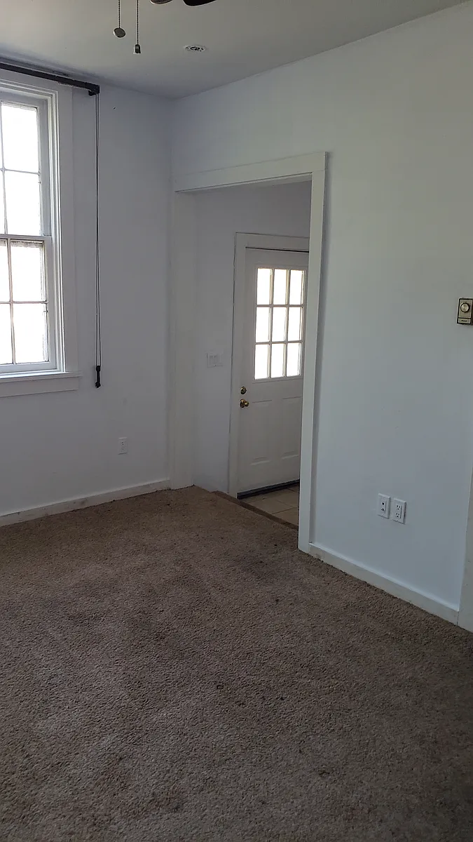 Living room with step down to front entrance. Brand new Carpet. As in 10x11 Bedroom (not pictured). - 607-615 Main St #N1