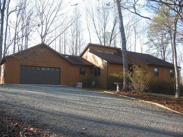 This home sits on top of a hill in a wooded 3+/- acre lot.