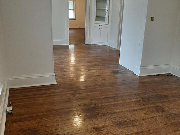 living room and dining room looking toward 4th bedroom or office
