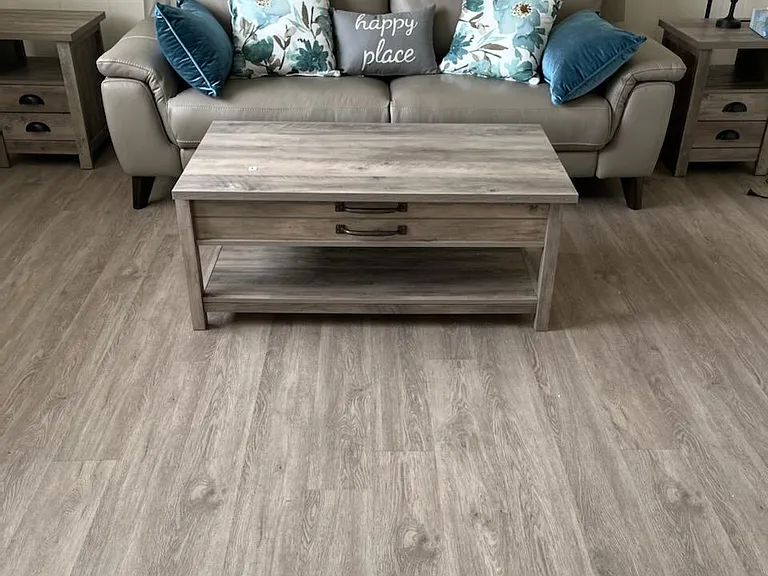 leather reclining couch for relaxing tv watching and pop up coffee table for enjoying meals on it!