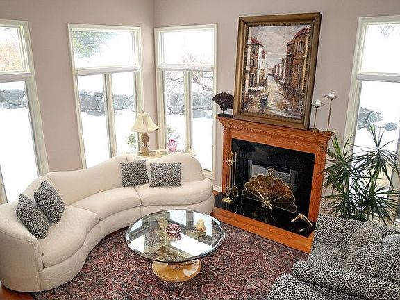 Living room with vaulted ceiling and gas firepace-perfect area to entertain