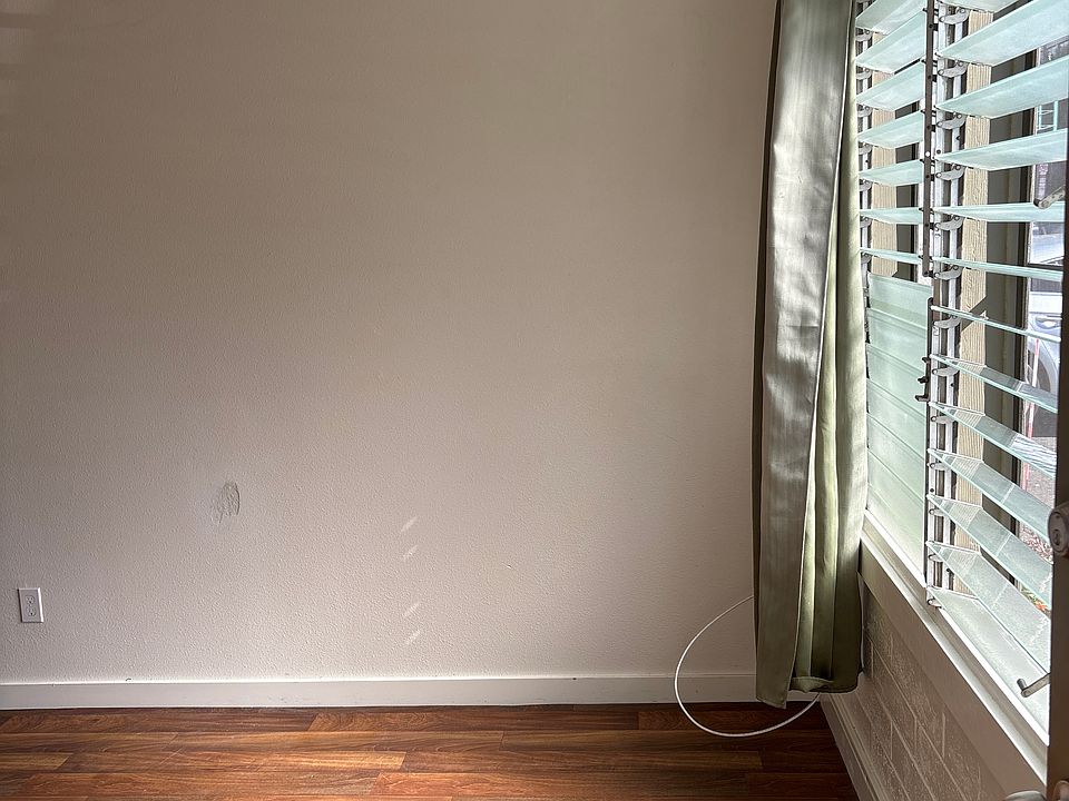 Living Room has a large window, access to natural light and the breeze!