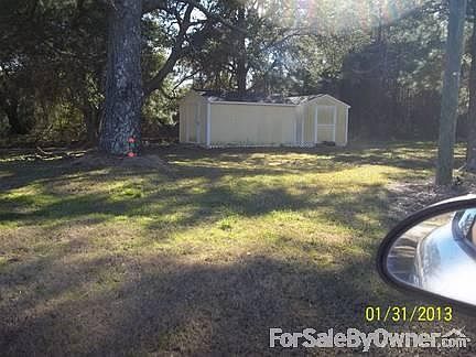Back yard
						:
						Two site built sheds sit on 3/4 acre.