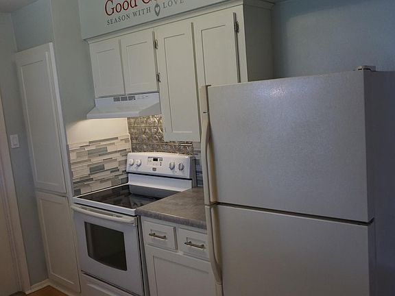 Kitchen with electric stove, vent and option to keep full size refrigerator