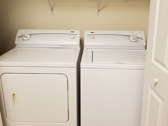 sliding doors house a full size washer and dryer