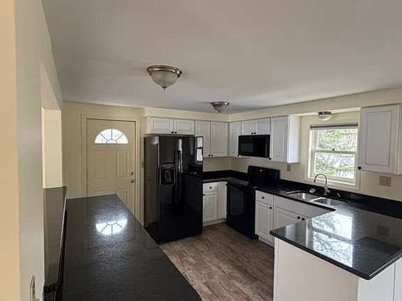 Spacious kitchen with updated appliances, plenty of storage and excellent layout.