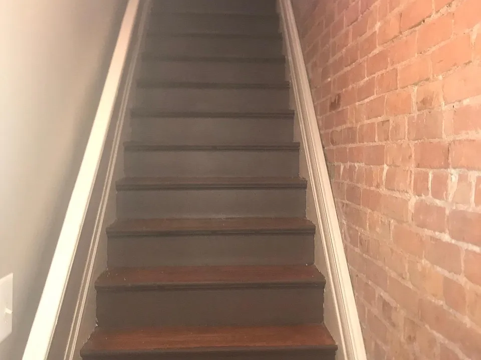 Stairs with Exposed Brick to Second Floor