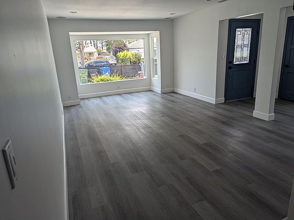 Living room looking at entry.