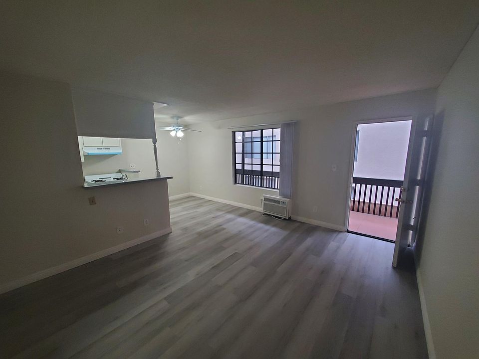 Spacious living room with gray plank flooring
