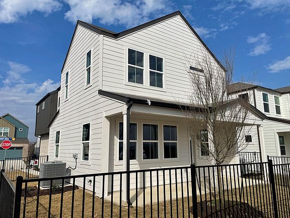 Expansive backyard with views of COTA and rolling Hills of South East Austin. Black Iron fence creates a secure and dedicated space for pets